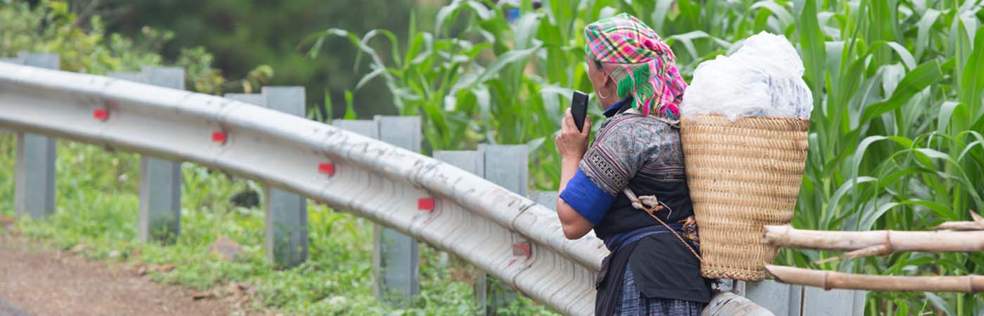 Person on outside on phone looking away from the camera